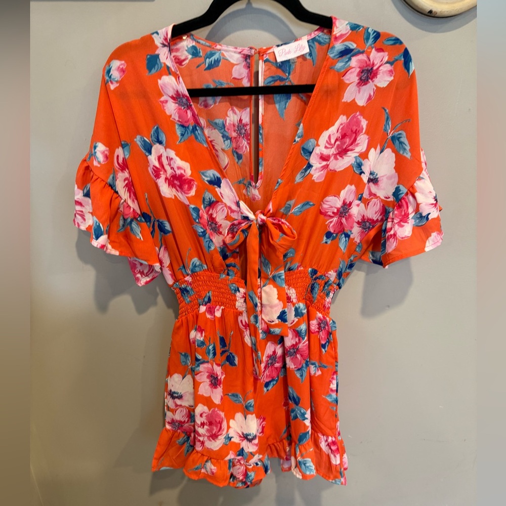 Orange Floral ruffle pink lily romper.